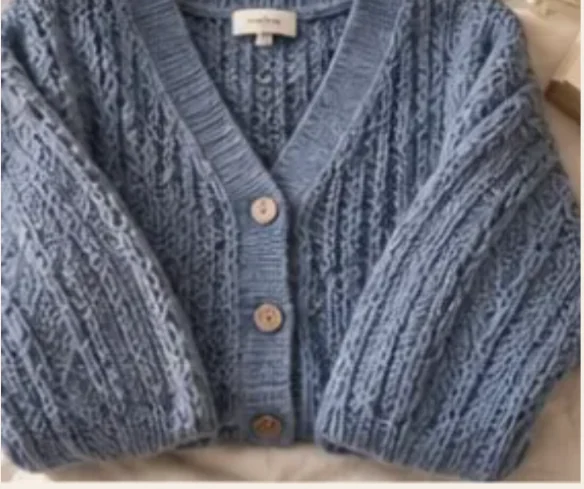 Soft blue cable knit cardigan, illustrative example